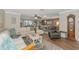 Spacious living room featuring hardwood floors, neutral tones, and comfortable seating at 303 Grayston Pl # C133, Sun City Center, FL 33573
