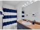 Nautical-themed bathroom with vanity and shower, creating a relaxing space at 308 28Th W St, Palmetto, FL 34221