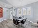 Inviting dining room with modern chandelier, stylish furniture, and wood flooring at 308 28Th W St, Palmetto, FL 34221