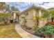 Inviting exterior featuring a sidewalk and meticulously maintained garden, enhancing the home's curb appeal at 308 28Th W St, Palmetto, FL 34221