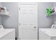 Functional laundry room with washer, dryer, shelving, and storage at 308 28Th W St, Palmetto, FL 34221