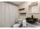 Well-appointed bathroom with stylish sink, mosaic backsplash, and modern fixtures at 3231 Beneva Rd # 101, Sarasota, FL 34232