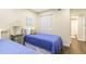 Charming bedroom with twin beds, wood floors, and ample closet space at 3231 Beneva Rd # 101, Sarasota, FL 34232