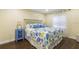 Relaxing bedroom featuring queen bed, coastal decor, and ample natural light at 3231 Beneva Rd # 101, Sarasota, FL 34232