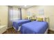 Inviting bedroom with twin beds, natural light, and tasteful decor at 3231 Beneva Rd # 101, Sarasota, FL 34232