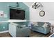 Inviting living room with modern furnishings, a large TV, and stylish decor at 3231 Beneva Rd # 101, Sarasota, FL 34232