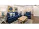 An inviting living room showcasing comfortable seating, tasteful decor, and a harmonious blend of living and dining spaces at 3231 Beneva Rd # 101, Sarasota, FL 34232