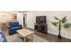 Inviting living room featuring a comfortable seating arrangement, modern TV, and seamless flow into the adjacent dining and kitchen areas at 3231 Beneva Rd # 101, Sarasota, FL 34232