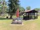 Community picnic area featuring tables, a grill, and covered gazebo at 3231 Beneva Rd # 101, Sarasota, FL 34232