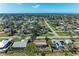 An aerial view displays a lovely neighborhood near the sea; perfect coastal living at its finest at 3285 Datura Rd, Venice, FL 34293