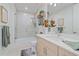 The bright bathroom features a glass-enclosed shower, contemporary vanity, and decorative accents at 332 Cocoanut Ave # 406, Sarasota, FL 34236