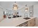 Modern kitchen view with stainless steel appliances and open layout to the living and dining areas at 332 Cocoanut Ave # 406, Sarasota, FL 34236