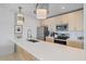 Modern kitchen featuring stainless steel appliances, white countertop, and light wood cabinetry at 332 Cocoanut Ave # 406, Sarasota, FL 34236