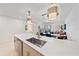 Modern kitchen with stainless steel appliances and open layout to the living and dining areas at 332 Cocoanut Ave # 406, Sarasota, FL 34236