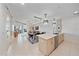 Bright, open living space with modern kitchen, dining area, and balcony, all in a modern style at 332 Cocoanut Ave # 406, Sarasota, FL 34236