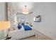Inviting main bedroom with a large bed, decorative wall art, and a TV, offering a relaxing retreat at 332 Cocoanut Ave # 406, Sarasota, FL 34236