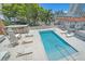 An aerial view of an urban rooftop pool offering seating, umbrellas and city views at 332 Cocoanut Ave # 406, Sarasota, FL 34236