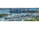 Expansive aerial view of the harbor showcasing the marina, waterfront condominiums, and the city skyline at 340 S Palm Ave # 152, Sarasota, FL 34236