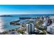 Breathtaking aerial view of a coastal city showcasing the marina, cityscape, and waterfront luxury living at 340 S Palm Ave # 152, Sarasota, FL 34236