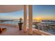 A grand balcony, complete with tiled floor and potted plant, showcasing a scenic view of the bay and city at 340 S Palm Ave # 152, Sarasota, FL 34236