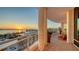 Spacious curved balcony with seating offers panoramic views of the marina, city skyline and a beautiful sunset at 340 S Palm Ave # 152, Sarasota, FL 34236