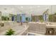 Bright bathroom featuring a soaking tub, glass block window, and dual vanity at 340 S Palm Ave # 152, Sarasota, FL 34236
