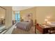 Bright bedroom with a balcony, a writing desk, and neutral decor at 340 S Palm Ave # 152, Sarasota, FL 34236