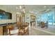 Modern clubhouse featuring bar seating, a TV, and balcony access with city views at 340 S Palm Ave # 152, Sarasota, FL 34236