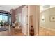 Hallway leading to living area showcasing artwork and modern furnishings at 340 S Palm Ave # 152, Sarasota, FL 34236