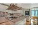 Modern kitchen featuring stainless steel appliances, custom cabinets and a center island at 340 S Palm Ave # 152, Sarasota, FL 34236