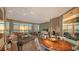 Spacious living area with panoramic water views, stylish lighting, and open layout to dining at 340 S Palm Ave # 152, Sarasota, FL 34236