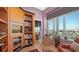 Cozy living room featuring custom built-in shelves and cityscape views at 340 S Palm Ave # 152, Sarasota, FL 34236