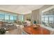 Open-concept living space with panoramic water views, stylish furnishings, and modern lighting fixtures at 340 S Palm Ave # 152, Sarasota, FL 34236