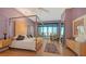 Main bedroom featuring a canopy bed, a private balcony and ample natural light at 340 S Palm Ave # 152, Sarasota, FL 34236