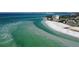 Breathtaking aerial view of Siesta Key Beach with turquoise waters at 3716 Camino Real, Sarasota, FL 34239