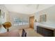 Bedroom featuring window shutters and a closet with wood doors at 3716 Camino Real, Sarasota, FL 34239