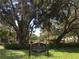 Granada Neighborhood sign, framed by lush trees and foliage at 3716 Camino Real, Sarasota, FL 34239