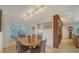 Dining Room with natural light from the outdoor scenery and easy access to the kitchen at 3716 Camino Real, Sarasota, FL 34239