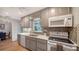 Bright kitchen features sleek countertops, modern appliances, and stylish backsplash at 3716 Camino Real, Sarasota, FL 34239