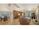 Living room area with tile floors, fireplace, built in bookshelf, and lots of light at 3716 Camino Real, Sarasota, FL 34239