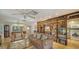 Living room area with tile floors, fireplace, built in bookshelf, and lots of light at 3716 Camino Real, Sarasota, FL 34239