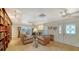 Living room area with tile floors, fireplace, built in bookshelf, and lots of light at 3716 Camino Real, Sarasota, FL 34239