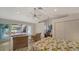 Bedroom features tile floors and access to deck and the pool at 3716 Camino Real, Sarasota, FL 34239