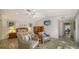 Bright main bedroom featuring tile floors and comfortable seating at 3716 Camino Real, Sarasota, FL 34239