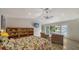 Main bedroom featuring tile floors and sliding glass doors to the patio at 3716 Camino Real, Sarasota, FL 34239