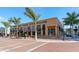 Exterior shot of Hyde Park Prime Steakhouse featuring palm trees and street-level view at 3716 Camino Real, Sarasota, FL 34239