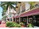 Lovely street featuring storefronts with awnings, manicured landscaping and trees at 405 Gowdy Rd, Sarasota, FL 34237