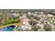 A scenic aerial view of a residential community with lush landscaping and well-maintained homes near water features at 406 116Th E St, Bradenton, FL 34212