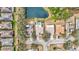 Aerial view of homes and community featuring private pool and a scenic pond at 406 116Th E St, Bradenton, FL 34212