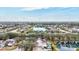 An aerial view of a community with lush greenery, several lakes, and a number of swimming pools at 406 116Th E St, Bradenton, FL 34212